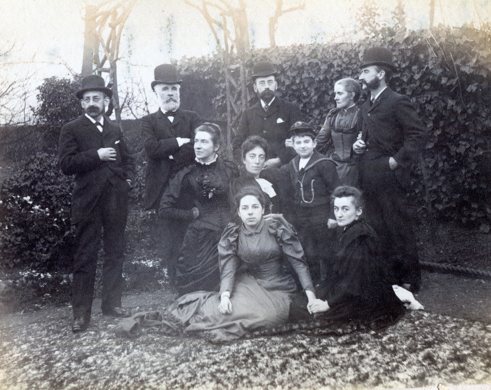 Left to right: (back) Fred Enock, Henry Dell (brother-in-law), Robinson Enock (brother), Emily Enock (Edwin's wife), Edwin Enock (brother), (middle) Jennie Enock (Fred's wife), Eleanor Enock (Robinson's wife), Roy Enock (Edwin and Emily's son) (front) Amy Dell (Henry Dell's daughter), Jane Enock (Fred's nephew, Guy Enock's wife) c1891